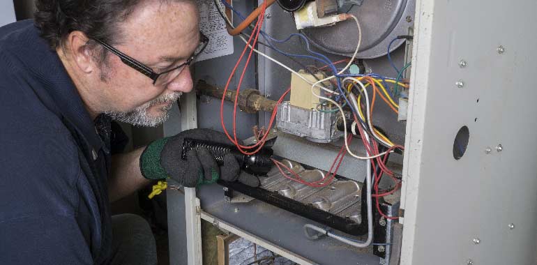 technician repairing heater