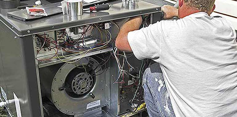 technician repairing heater